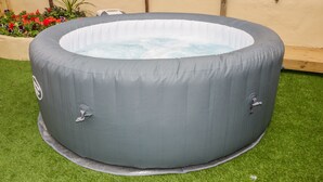 A gray inflatable hot tub with two faucets, placed on artificial grass. - Fistral Quay (Newquay)