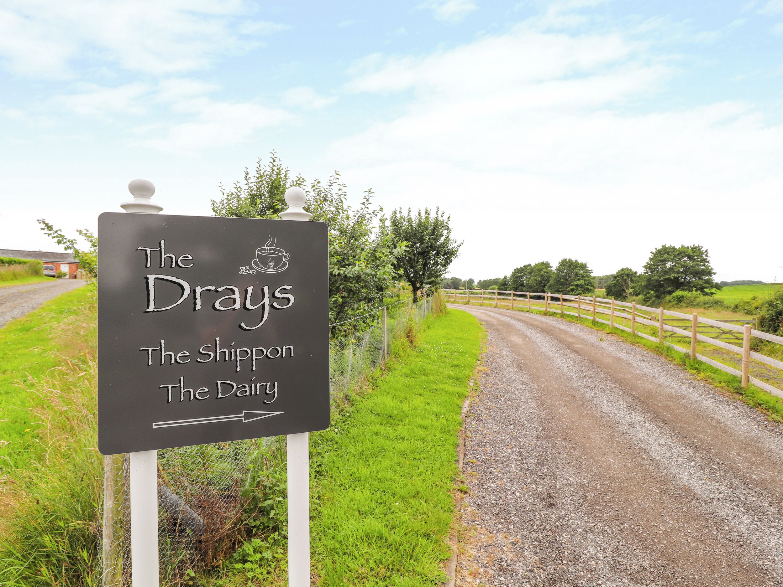 A sign for 'The Drays' with a directional arrow.