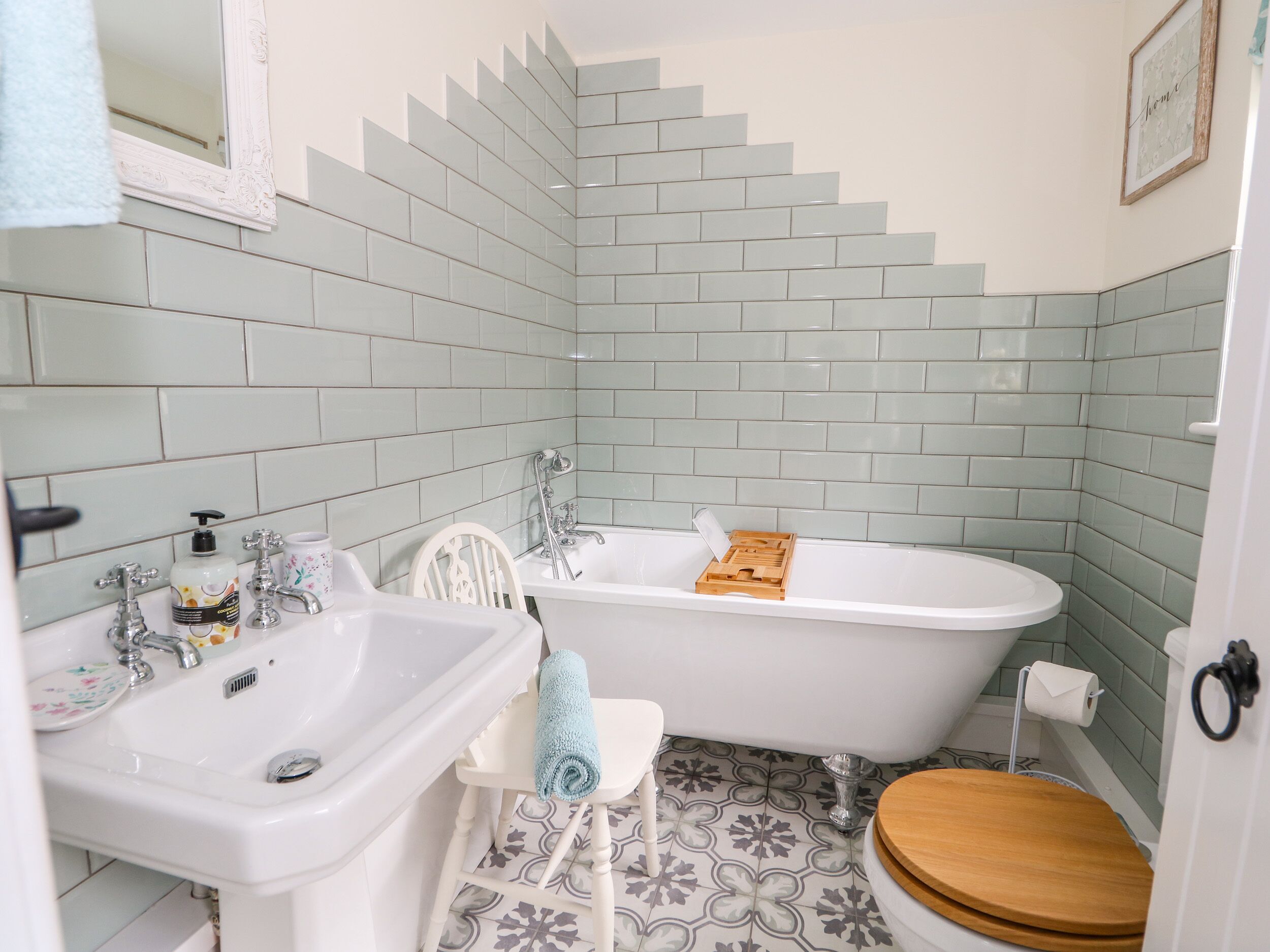 A bathroom with a sink, toilet, and bathtub.