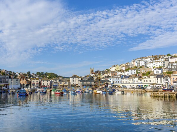Stunning harbor views from a hillside town with a mix of traditional and modern architecture.