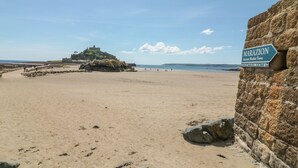 A beach with a sign reading "MARAZION Ancient Market Town". - Sea Dreams (Marazion)