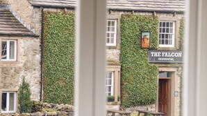 A building with a sign reading "The Falcon Residential". - Croft Cottage (Skipton)