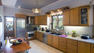 Villa, 4 Bedrooms | Private kitchen | Full-sized fridge, microwave, oven, stovetop