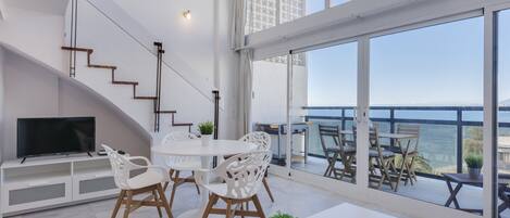 Duplex, 1 Bedroom, Sea View | Living room | 120-cm flat-screen TV with cable channels, TV, Netflix