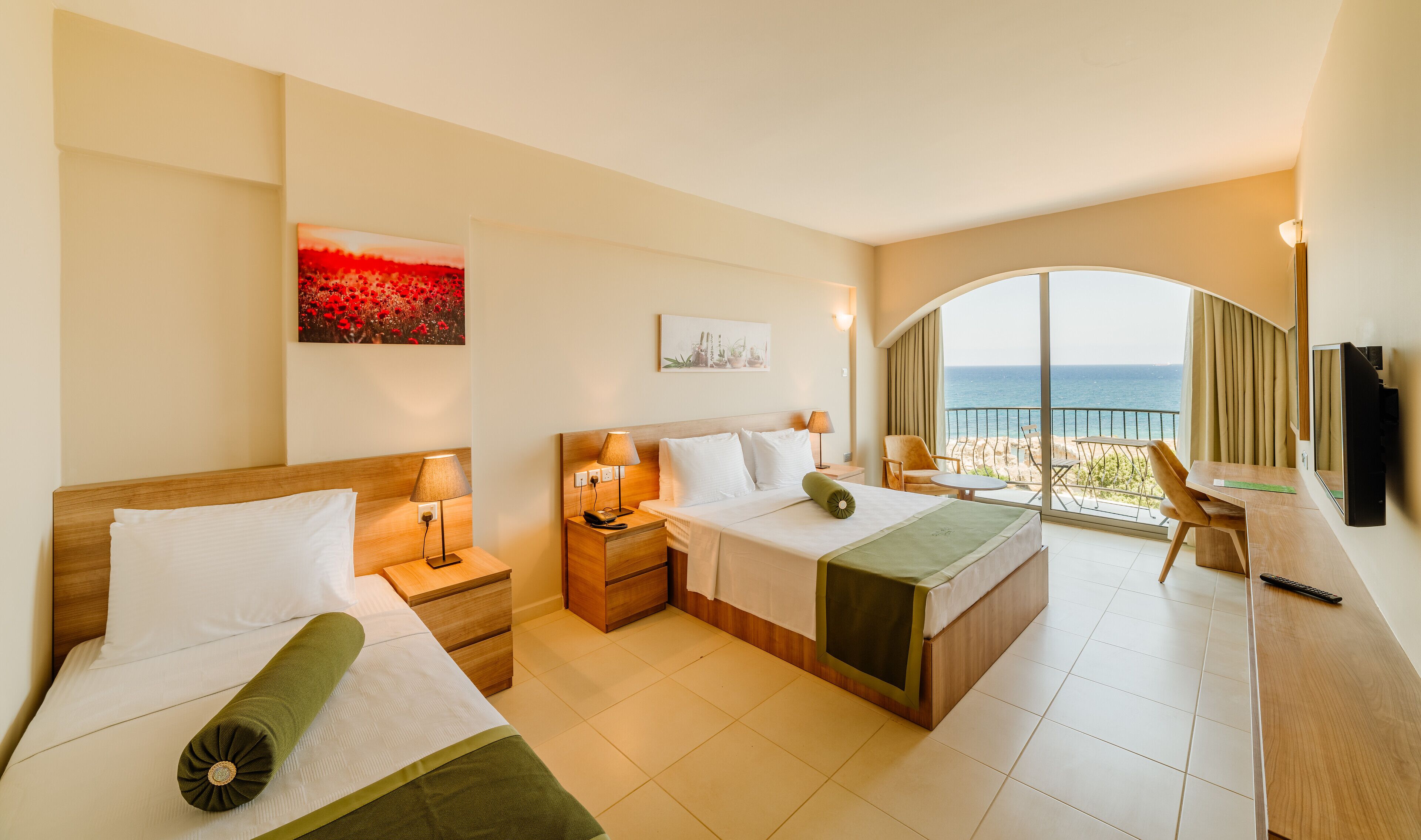 standard triple room, sea view | minibar, in-room safe, individually decorated, individually furnished