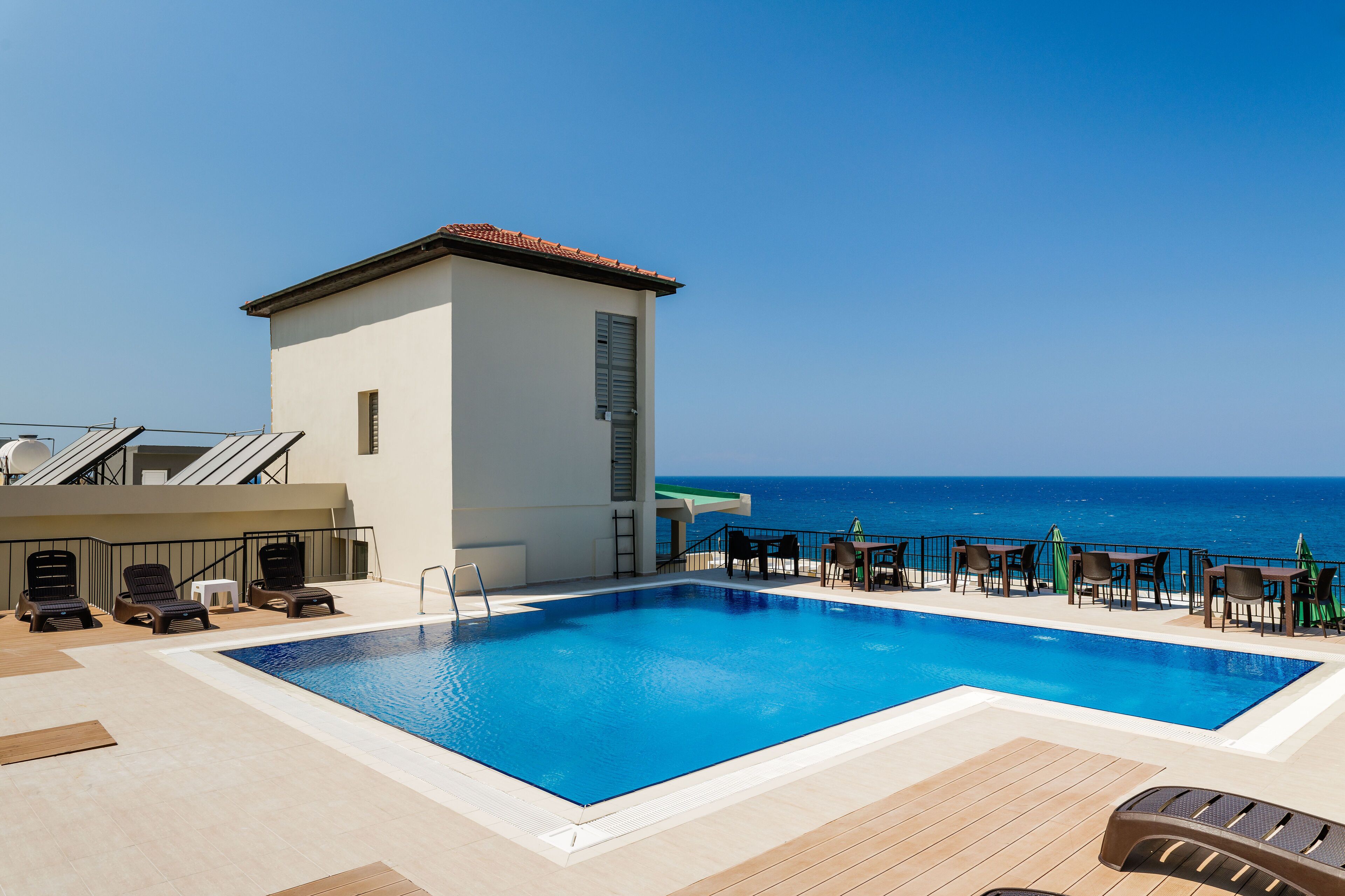 outdoor pool, open 8:00 am to 6:00 pm, pool umbrellas, pool loungers