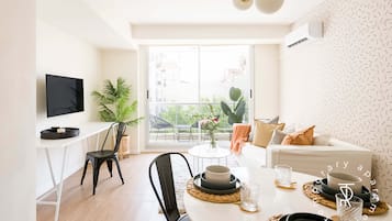 Apartment, 2 Bedrooms | Living area | 42-inch Smart TV with cable channels, TV, pay movies