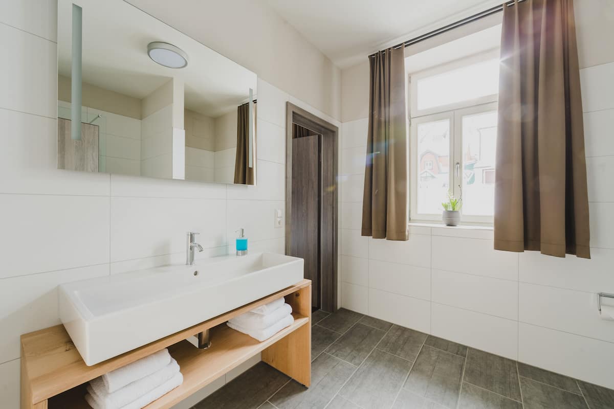 apartment | bathroom | shower, hair dryer, towels, soap