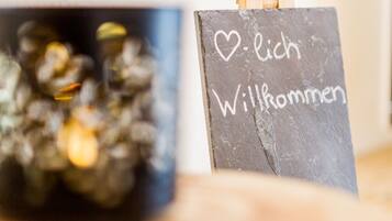 A chalkboard with "Willkommen" written on it, suggesting a welcoming message.