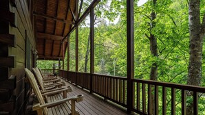 A wooden deck with benches overlooking a forested area. - Free Tickets | Creek-Side, Views, INSANE Arcade, Yard, Fireplace (Sevierville)