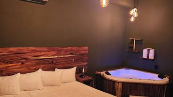 Suite, Hot Tub | Down comforters, in-room safe, individually decorated