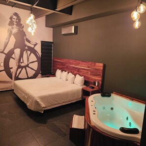 Suite, Hot Tub | Down comforters, in-room safe, individually decorated