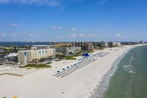 On the beach, sun loungers, beach towels, kayaking