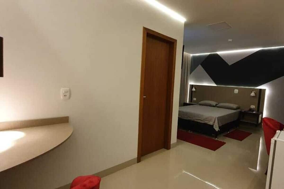 Deluxe Double Room | Minibar, desk, laptop workspace, blackout drapes