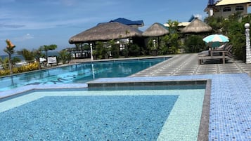 Outdoor pool, open 7:00 AM to 7:00 PM, sun loungers