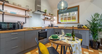 A light and airy property with a hammock and hot tub, situated on a working farm