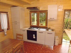 Comfort Bungalow, 2 Bedrooms (Sole) | Private kitchen | Oven, stovetop, coffee/tea maker, cookware/dishes/utensils - Villaggio Turistico Sol&Verde (Gornate Olona)