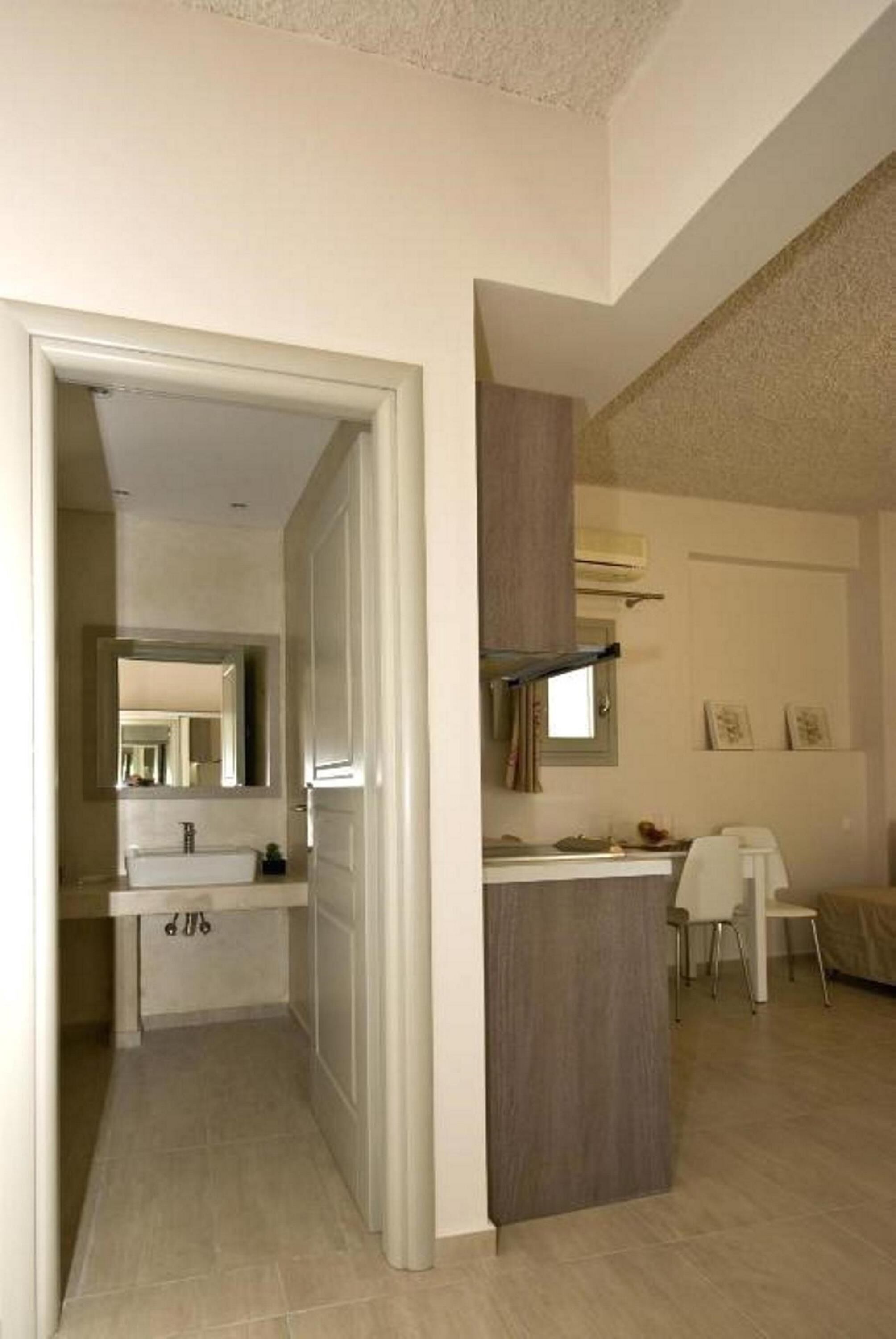 mini-fridge, stovetop, electric kettle, cookware/dishes/utensils