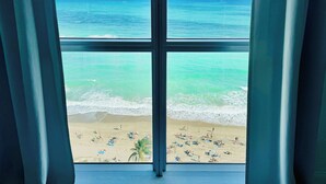 A beach view through a window with a clear sky and ocean. - The Tides on Hollywood (Hollywood)
