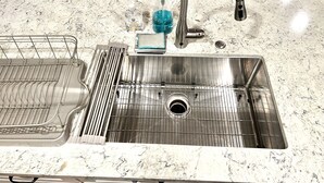 A stainless steel kitchen sink with a marble countertop, a dish rack, and a soap dispenser. - Recently remodeled! Close to everything in majestic Snowcreek Resort (Mammoth Lakes)