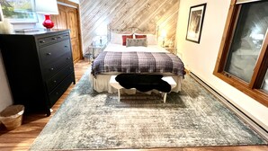 A bedroom with a bed, dresser, and a ceiling fan. - Recently remodeled! Close to everything in majestic Snowcreek Resort (Mammoth Lakes)