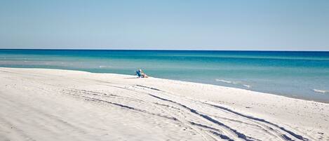 On the beach, sun-loungers