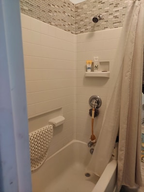 Combined shower/tub, hair dryer, towels, soap