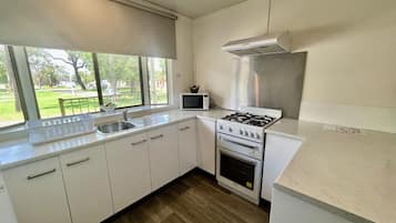 Family Cabin | Private kitchen | Fridge, microwave, oven, stovetop