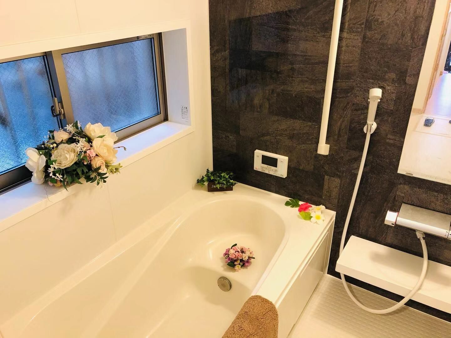 Bathtub, hair dryer, towels, soap