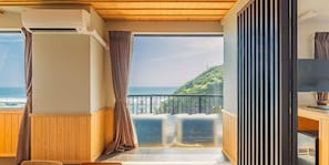 Suite, Non Smoking, Sea View | 1 bedroom, desk, laptop workspace, iron/ironing board