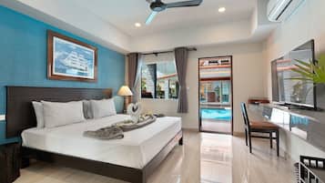 Deluxe Room, Pool View | In-room safe, desk, free WiFi