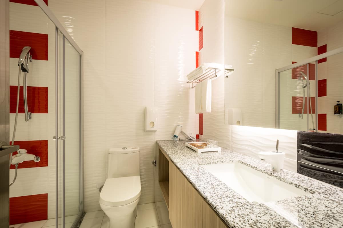 standard quadruple room | bathroom | shower, free toiletries, hair dryer, slippers