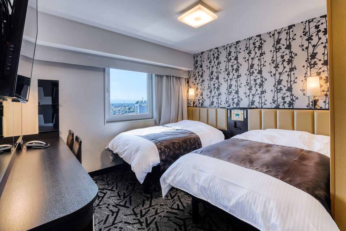 Standaard Twin kamer | Een bureau, verduisterende gordijnen, gratis wifi, beddengoed