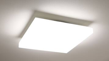 A ceiling with a recessed square light fixture.
