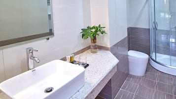 Shower, free toiletries, hair dryer, slippers