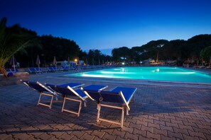 Seasonal outdoor pool, open 10:00 AM to 9:00 PM, pool umbrellas