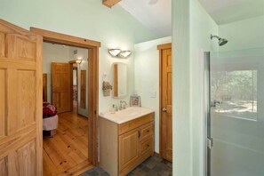 Bathtub, hair dryer, towels, shampoo