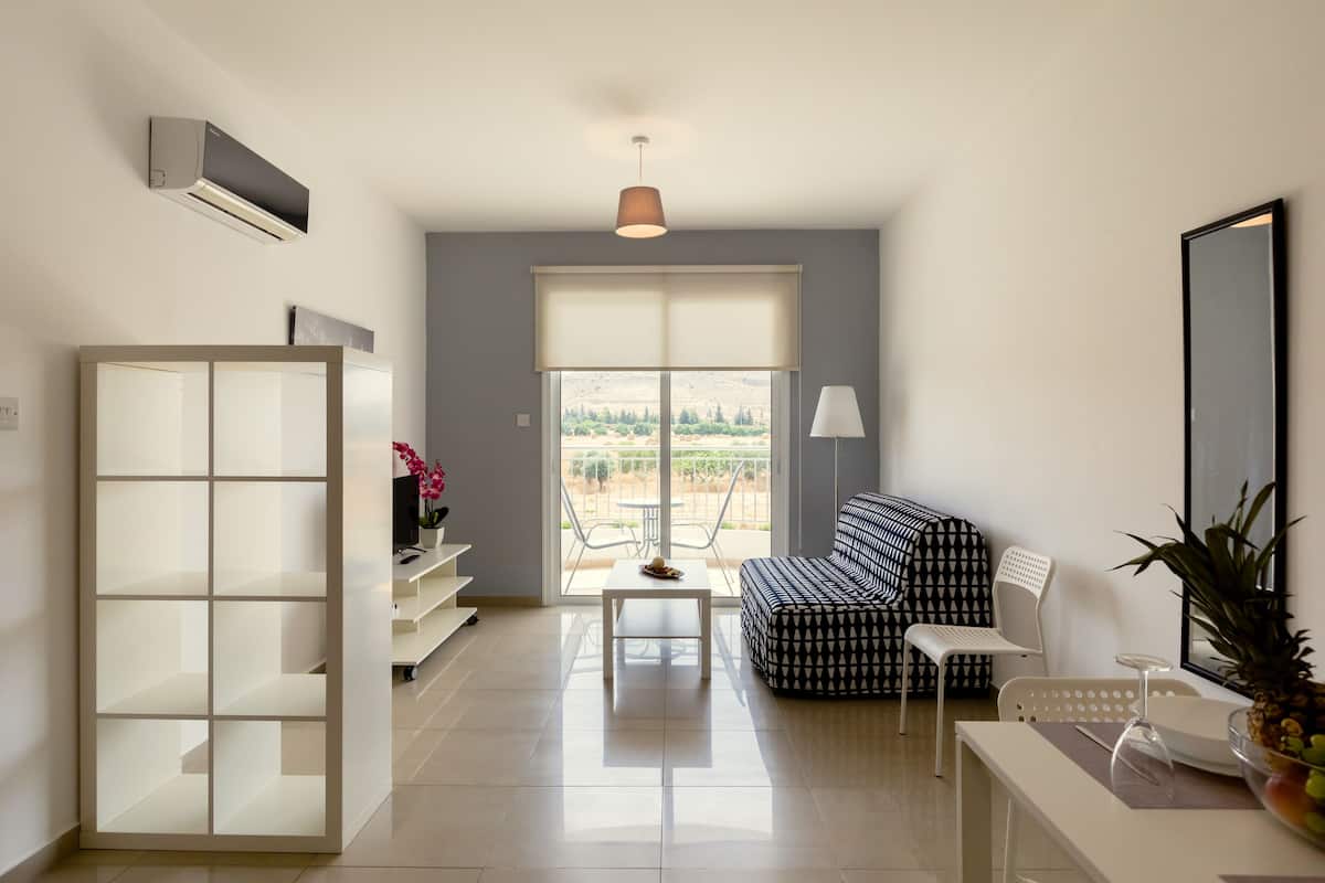 Apartment, 1 Bedroom | Living room | Flat-screen TV