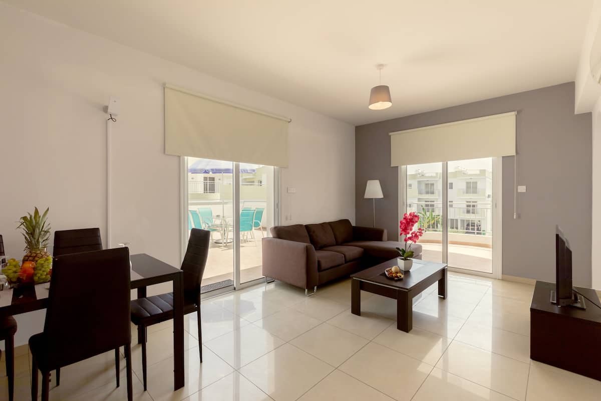 Penthouse, 2 Bedrooms | Living room | Flat-screen TV
