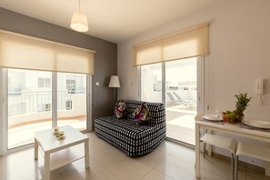 Penthouse, 1 Bedroom | Living room | Flat-screen TV