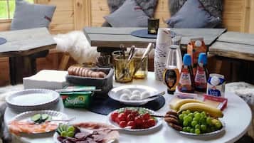 A breakfast buffet with various food items and condiments.