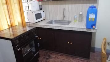 Fridge, microwave, electric kettle, cookware/dishes/utensils