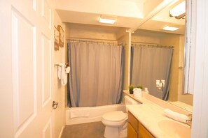 Bathtub, hair dryer, towels