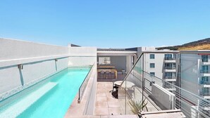 A rooftop pool with a clear view of the surrounding buildings. - The Paragon 317 (Cape Town)