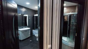 Combined shower/tub, hair dryer, towels, soap