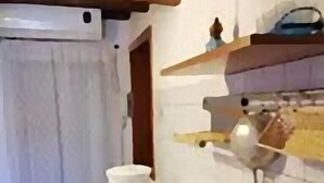 A kitchen with two sinks, a white countertop, and a wooden ceiling. - near the sea and the center of San Vito Lo Capo is ideal for families (San Vito Lo Capo)