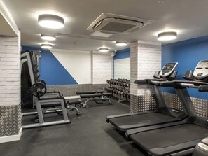 A gym with treadmills, dumbbells, and weightlifting equipment. - Yugo Explore - Broadstone Hall (Dublin)