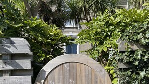 A wooden gate with a sign reading "29 Porth House." - Porth House with south facing courtyard garden! (St Ives)