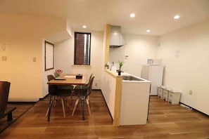 Enjoy a compact apartment with a kitchenette, dining area, and a small island.