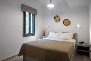 2 chambres, coffres-forts dans les chambres, fer et planche à repasser